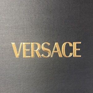 Versace Gold Lettering on Dark Canvas